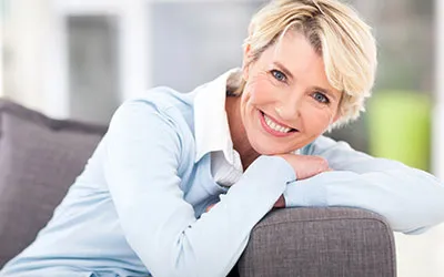 Woman smiling with natural looking dental implants